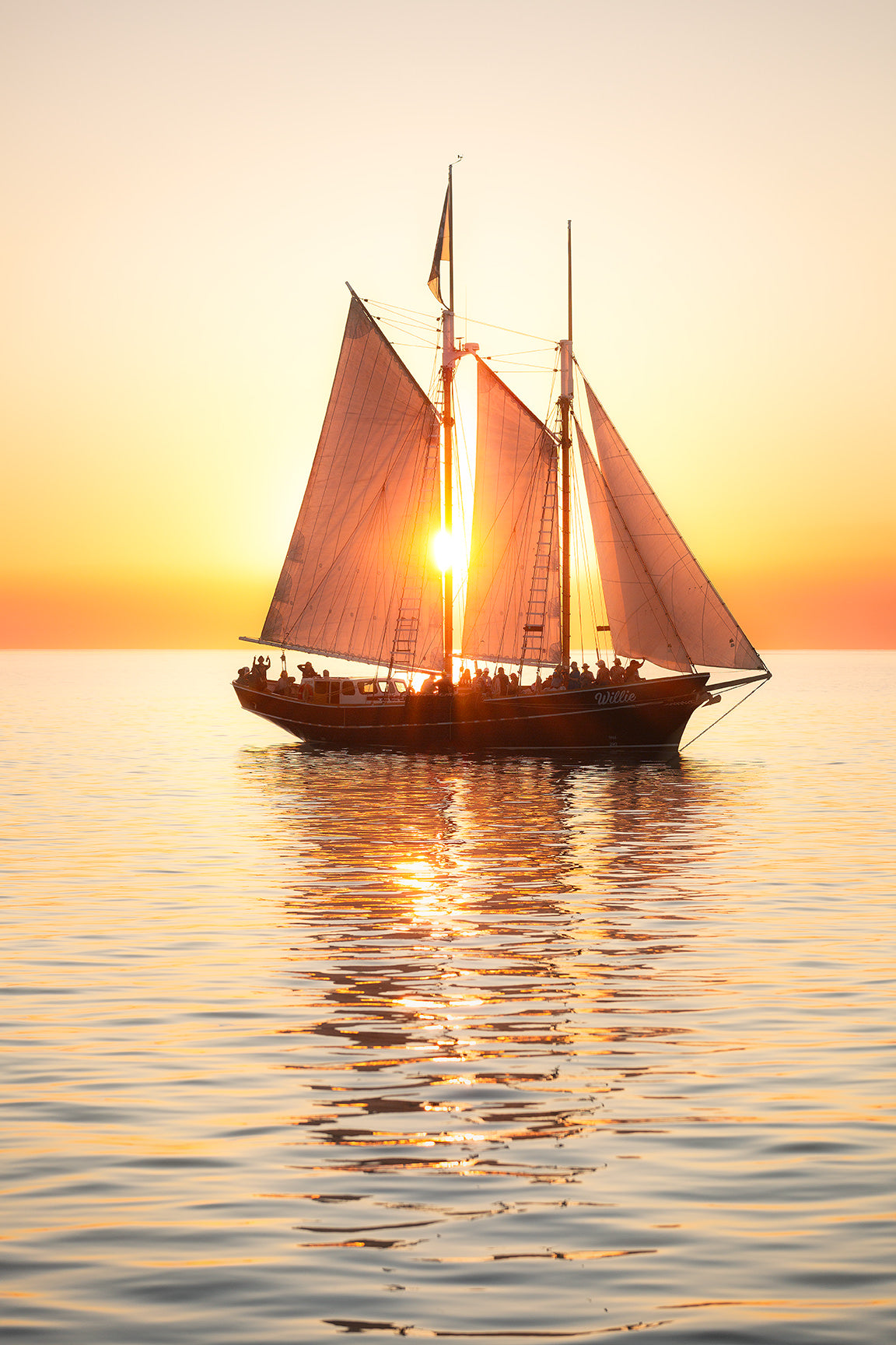 boat sailing in the sea with sunset